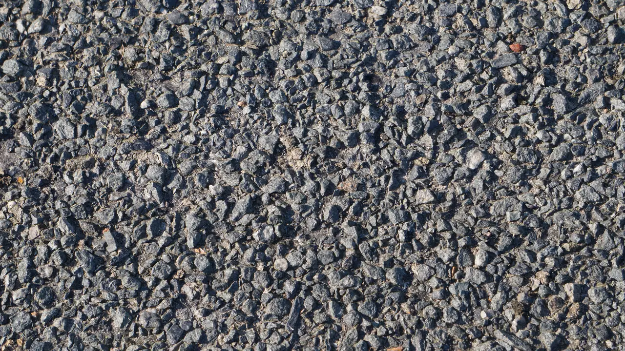 Close-up of a coarse gray aggregate pavement surface